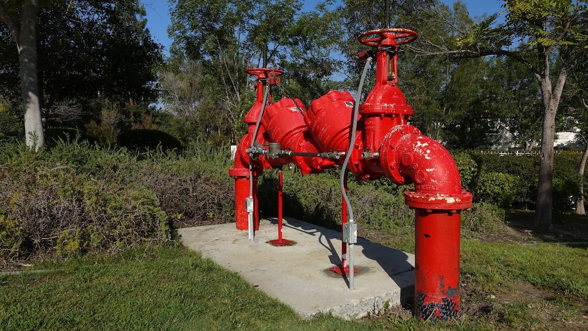 Double-check back flow preventer with metered bypass valve