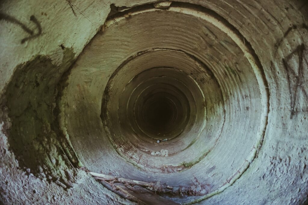 Inside underground sewerage pipe tunnel without water, 