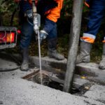 Cleaning storm drains from debris, clogged drainage systems are cleaned with a pump and water