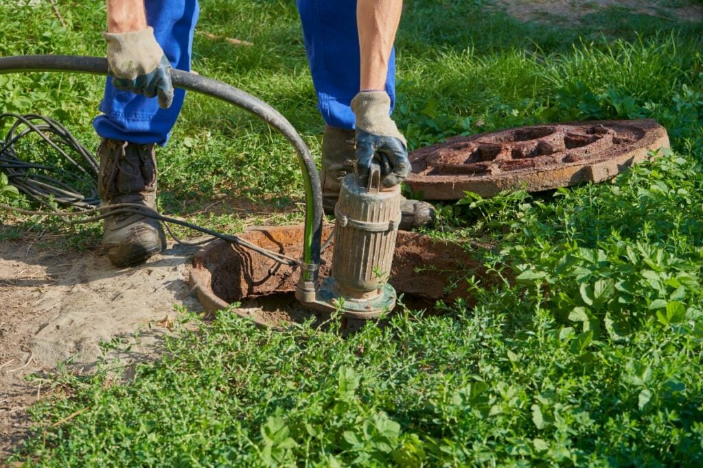 pumping out a home septic tank with a pump