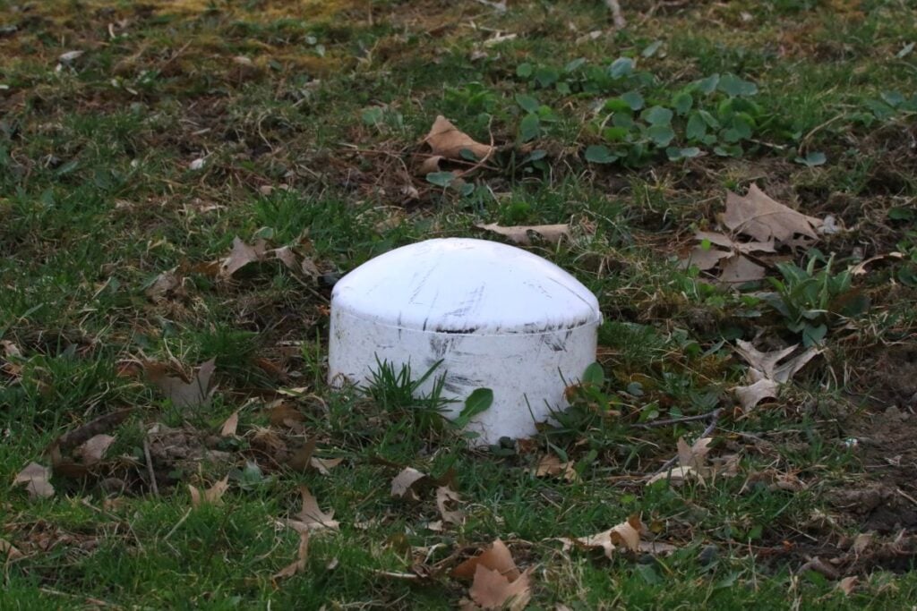 Capped sewer clean out pipe located in the lawn