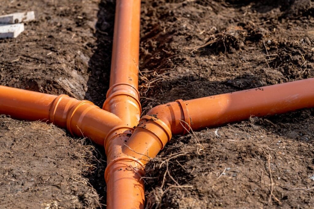 sewage system made of plastic PVC pipes in the ground