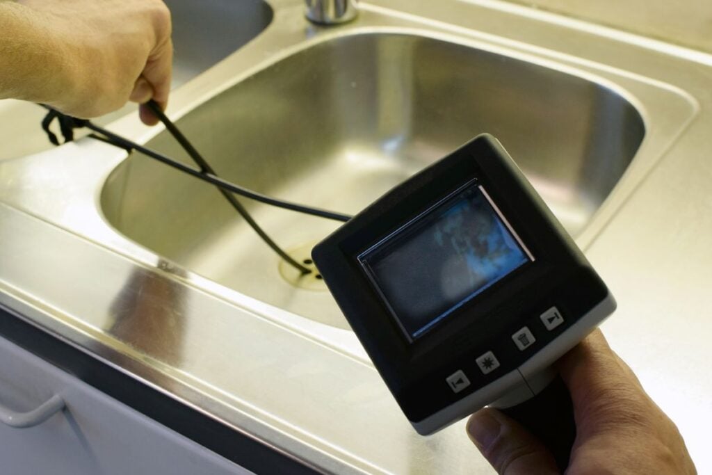 Checking drain pipe in a sink