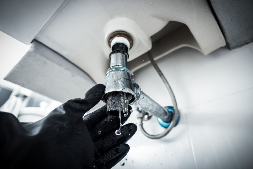 clogged and leaky sink sewer