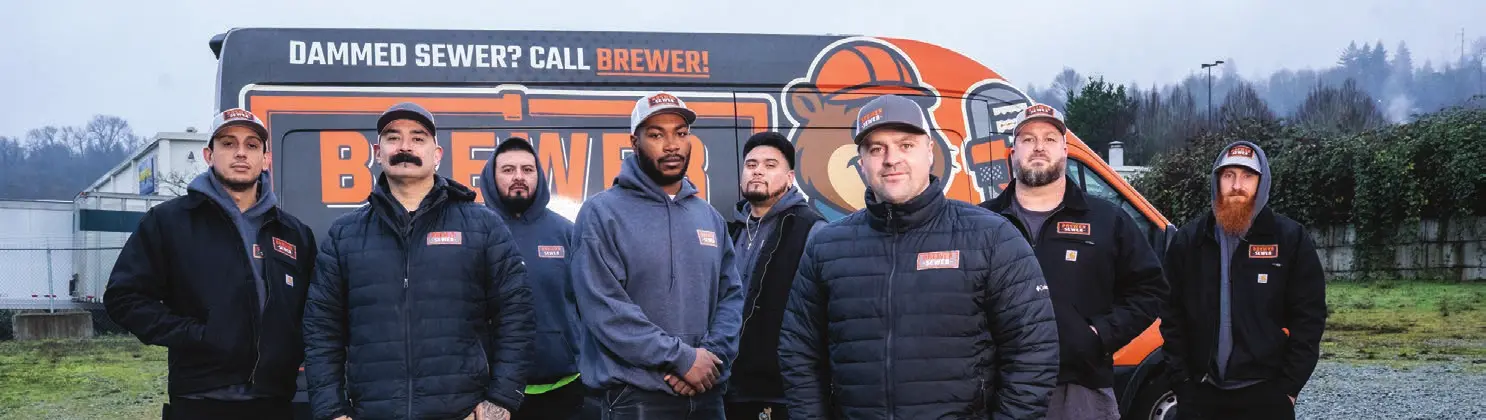 Brewer Sewer team photo next to the van