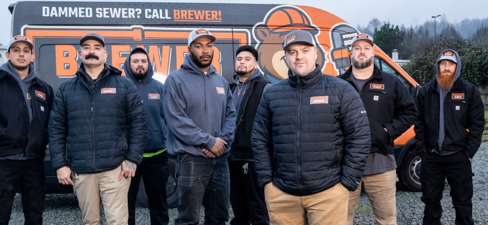 Company team photo with Brewer's Sewer local sewer service team standing in front of their company truck.